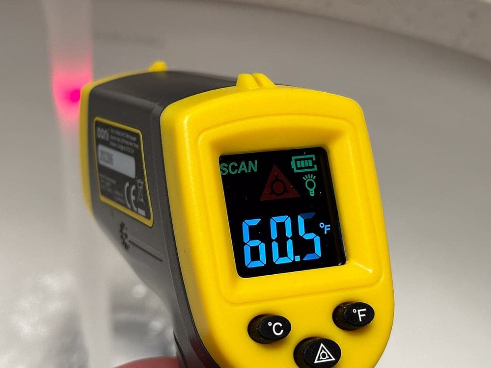 A handheld infrared thermometer gun
